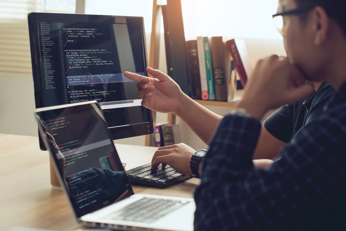 Designer discussing and creating a website with a client